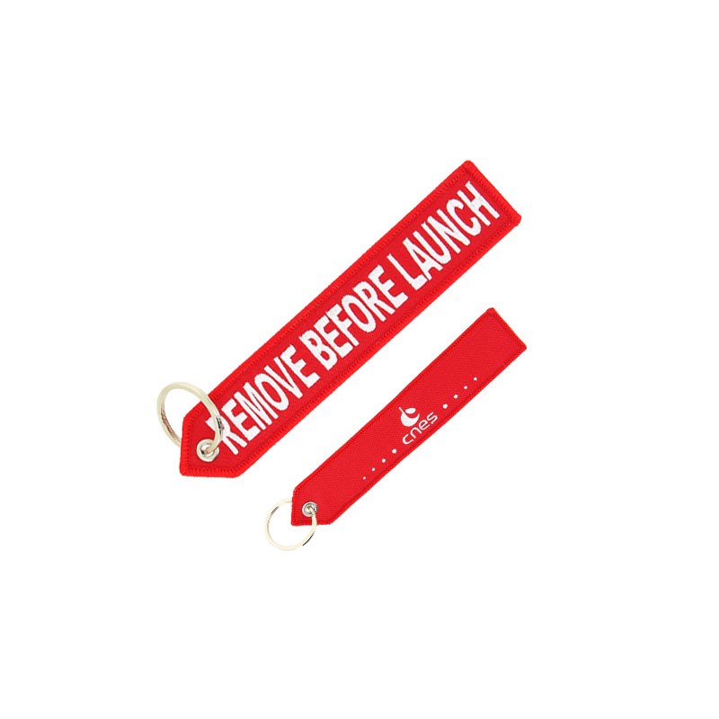 CNES red key ring "Remove before Launch"