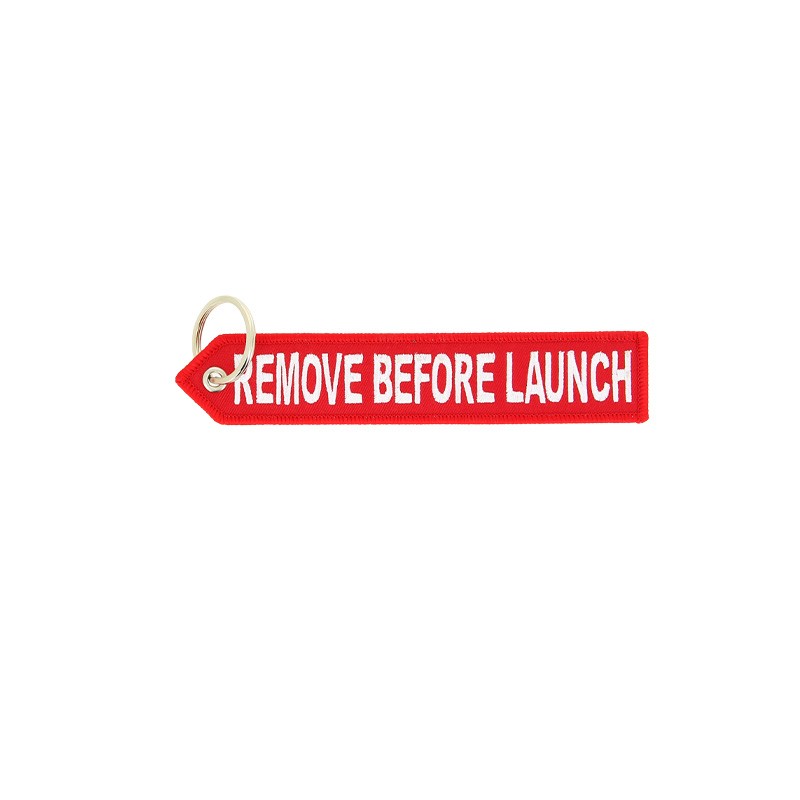 CNES red key ring "Remove before Launch"