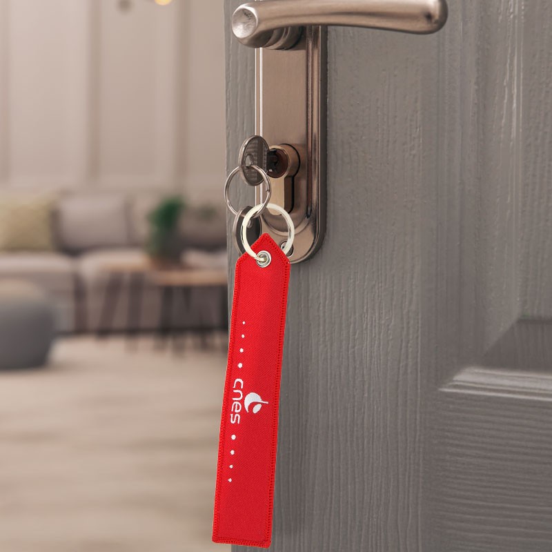 CNES red key ring "Remove before Launch"